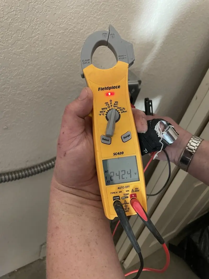 Voltage testing with clamp meter during Outlet Installation in Alta Sierra